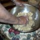 Put the ground wheat, most of the ground nuts, the vanilla and 200 mg of the sugar in a very large bowl. (You need to save enough nuts to cover the finished mound, so put them aside now or you will have to get out the nut grinder again.)