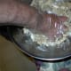 You need to keep up a squeezing motion with your hands because you will need to know when the mixture is finally holding together. You want the sugar crystals to dissolve and the mixture to be able to be molded when you are finished.