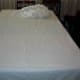 Next, arrange a large white cotton sheet over the towels. Do not use flannel. Smooth the sheet out as best you can. As you can see, I didn't iron it, but one could.