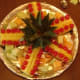 Lay out the pineapple top and the prepared pieces around it.