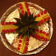 Lay out the pineapple top and the prepared pieces around it.