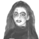 Fancy goth girl Halloween makeup with dark shadows, face scars, eye accents and white skin