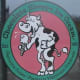 funny cow eating ice cream in pink and green clip art fashion on store front in Lake Geneva Wisconsin