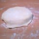 Repeat the procedure seven times. Do not brush the lard over the final dough. Set aside.