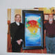 My Wife and I Standing Next to Peter Max and One of His Paintings That We Didn't Buy. It was $ 60,000 for goodness sakes. (He brings his own photographer, by the way.)