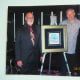 SIMON BULL AND THE WORK (SUGAR) WE PURCHASED, AQUATINT, HAND COLORED w/ACRYLIC INK, PASTEL, HAND APPLIED SILVER (2001)