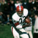 Cleveland Hall of Fame running back Jim Brown (32) gets past New York Giants safety Henry Carr during a 34-21 Browns victory on Nobemver 14, 1965, at Cleveland Municipal Stadium in Cleveland, Ohio. (Photo by Tony Tomsic/NFL)