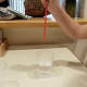 When you remove your finger the water flows out.