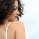 The back of your bra should go around you evenly similar to a belt. The back should not ride up your back, if it does, you need a different size bra.