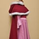 Side view. You can see here how the cape doesn't wrap around the front like her blue cape does, it just hangs down the back so as not to cover too much of the dress.