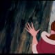 Hood off, still keeps it's shape for the most part, so this indicates a rather thick fabric. If you look at the shot of Belle by the fireplace, the cape is hanging up in the background. It hangs rather lightly, so doesn't look like it's made of wool