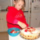 Then she adds the strawberries.