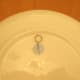 apply generous amount of glue to roughed up surface -- sit wire hook onto glue