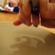 wrap the wire around the sharpie twice to make a loop