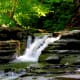 Stony Brook State Park includes natural water slides, waterfalls, and a swimming hole.