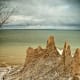 Chimney Bluffs State Park is located on Lake Ontario and has spectacular spires created by glaciers.