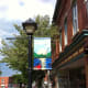 Colorful artistic hand painted banners go up down the streets.
