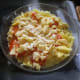 Add the mashed potatoes on top of the cauliflower cheese and top with sliced tomatoes and any hard cheese, and a sprinkle a little parmesan cheese on top.