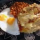 Serve with baked beans and egg.