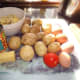 Basic ingredients for making Potato and Cauliflower Cheese Pie - Surplus Cauliflower Cheese, potatoes, tomatoes, eggs, cheese and baked beans.
