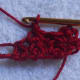 Draw a loop in the next top loop, y o, draw through all loops on hook, ch 1.