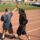 Glenn grabs Jamie by the wrist