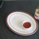 Sweet chilli dipping sauce is served in a small ramekin