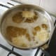 Deep frying spicy chicken and potato fritters