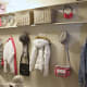 Create a longer open closet using full size painted boards and bathroom hooks. Plenty of storage now.