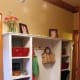 Individual cubbies with open center space for hanging clothes. Storage under bottom shelf for shoes.