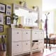 By cutting off the back legs of a cabinet, you can bring it flush to the wall. Drop drawers from 2 cabinets joined together by one countertop.