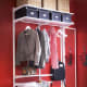 Metal unit with brackets create this open closet hallway space. Clothes rod, shelves, baskets and slide baskets.