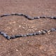 Lovers have a habit on the headlands of creating hearts out of stones