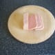 Moderately thin slices of Spam taken from block