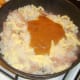 Curry sauce is added to fried rice