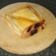 Cheese and Spam toastie is briefly rested