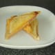 Trimmed and sliced cheese and Spam toastie is plated