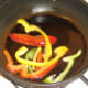 Briefly frying bell pepper slices