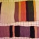 A full-sized scarf next to a scaled-down scarf