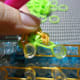 First stitch of the second Round. Notice that instead of working this stitch on the cap band, the stitch is worked on the first band of Round 1.