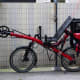 A Recumbent two wheel bicycle with saddle bags.