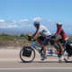 A tandem bicycle fully loaded.