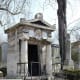 New ancient chapel shaped Roman temple distyle to Doric Greek columns and parapets with palm leaves.