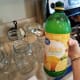 Step 19: Add 2 tablespoons of lemon juice to each quart jar.