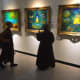 Monks discussing about the painting