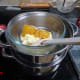 Adding the lemon curd to the melted white chocolate
