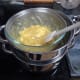Giving it a quick stir to mix the lemon curd into the white chocolate