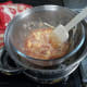Giving it a quick stir to mix the jam into the white chocolate