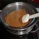 The milk chocolate melted and ready for dipping the cocoa coated truffle balls in
