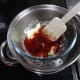 Adding the jam to the melted white chocolate